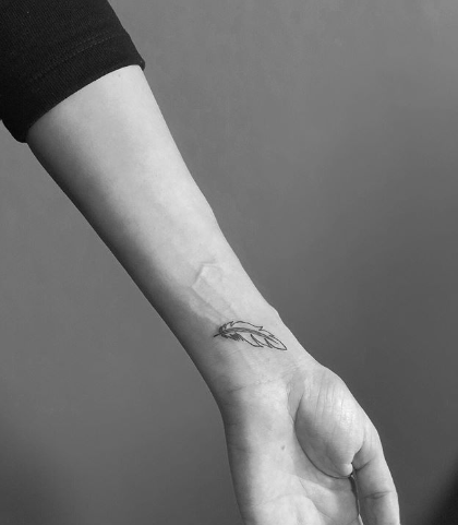 Beautiful Feather Tattoo On Wrist  Feather tattoo wrist Feather tattoo  colour Feather tattoos