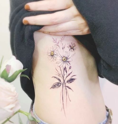 Daisy tattoo of a Tattoos Book: