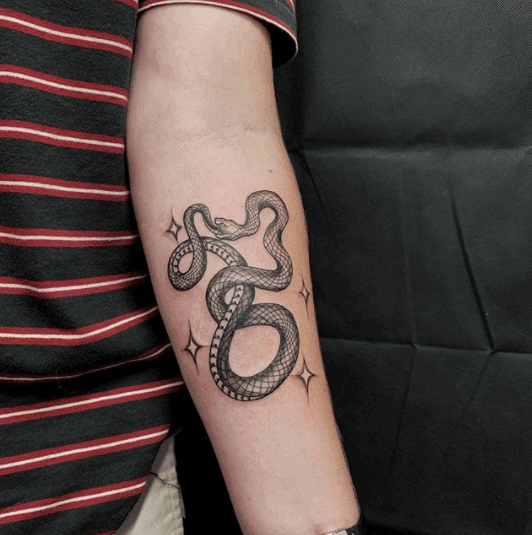 snake eating itself tattoo
