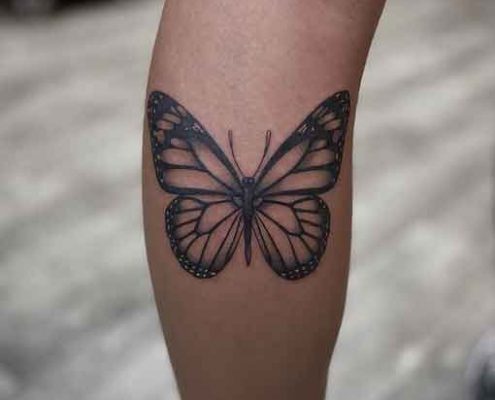 Black and white monarch butterfly tattoo by @ericamarietattoo