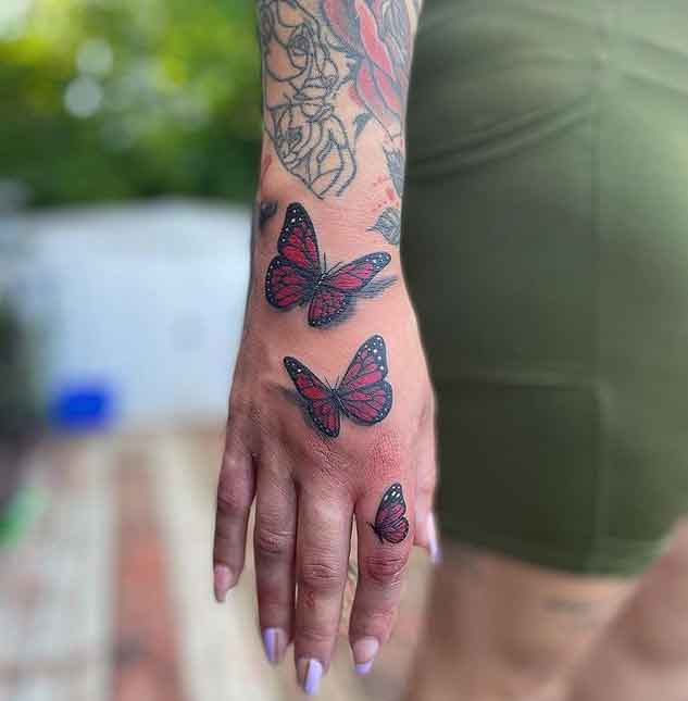 Black And Pink Butterfly Tattoo On Front Shoulder