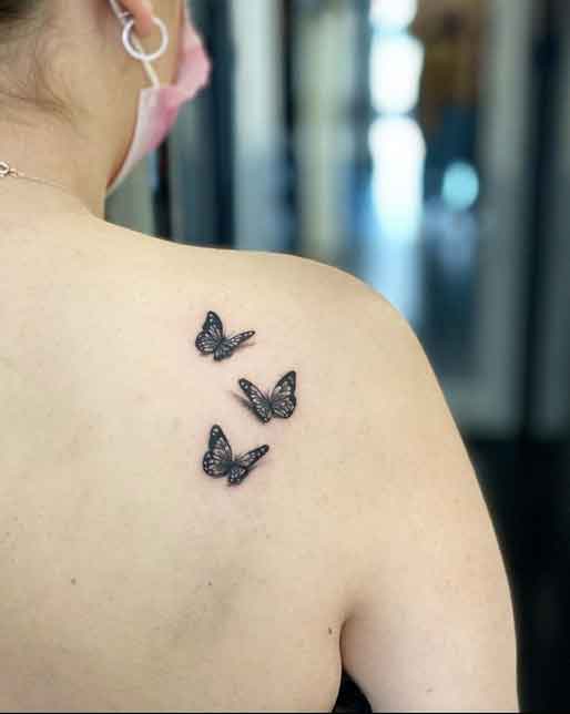 Butterflies tattoo located on the forearm