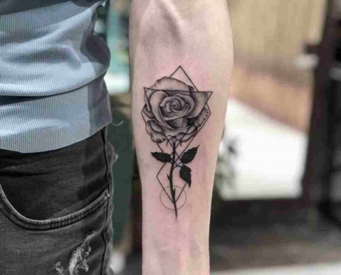 Geometric black rose tattoo by @caglayan.tattoo