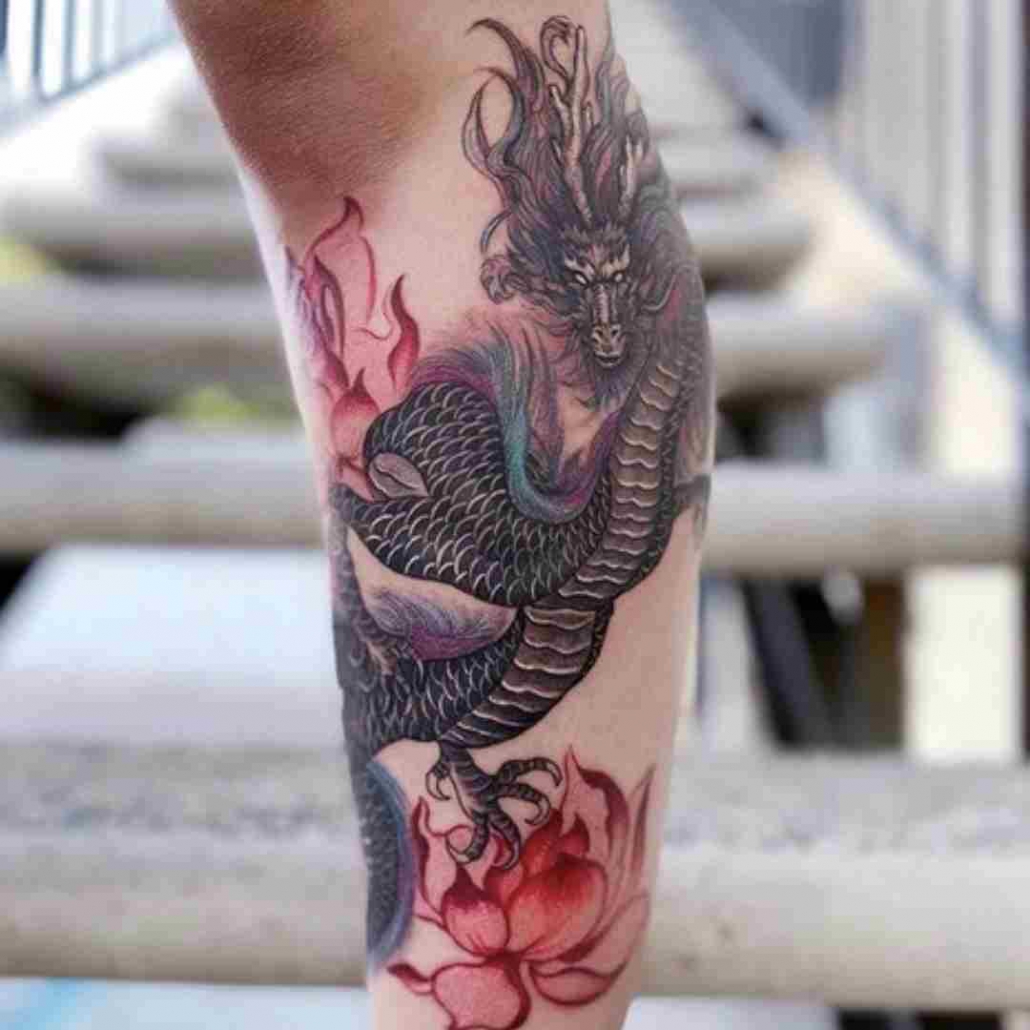 Tattoo uploaded by Jen Mogg • Girly dragon on thigh #black #flowers # dragontattoo #thightattoo #birminghamtattoo #sevenfoxestattoo • Tattoodo