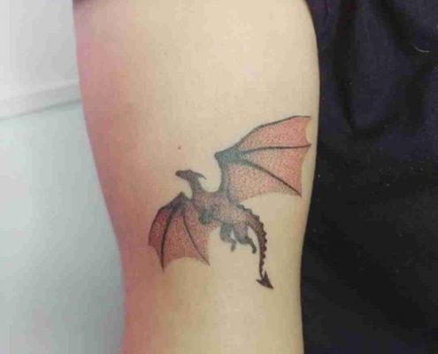Small realistic Red dragon tattoo by @hellena.ink