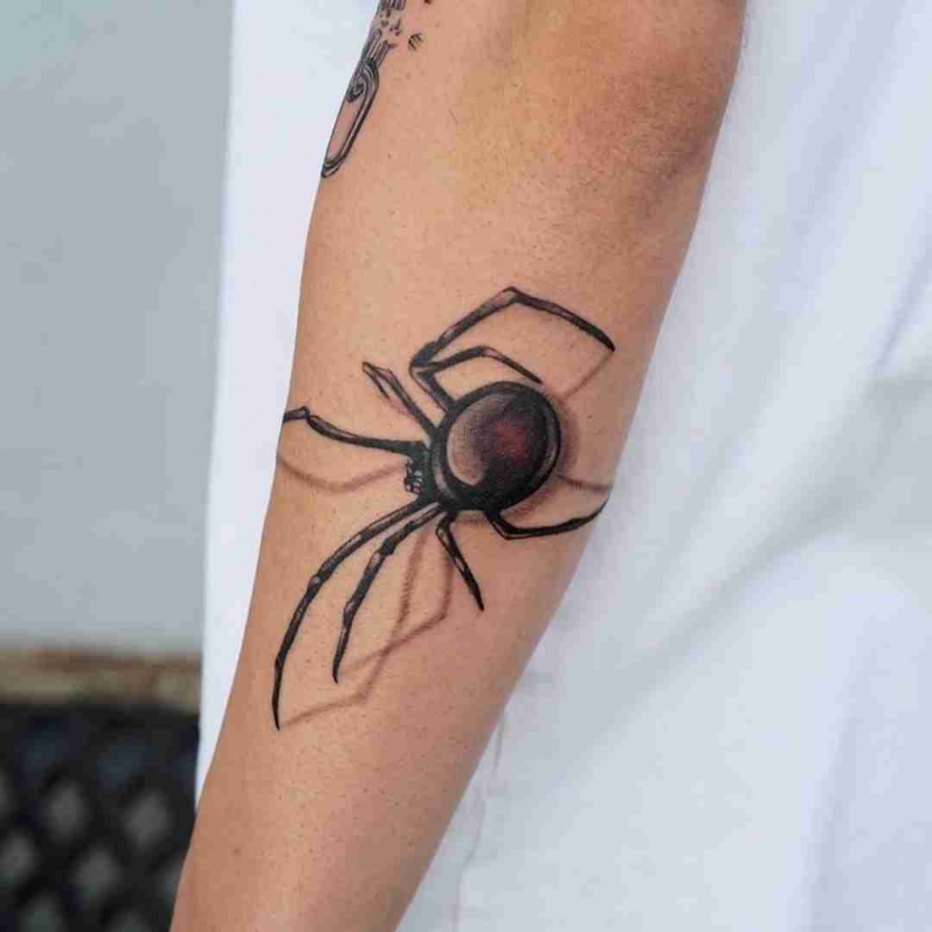 Spider web tattoo meaning explored as TikTok vids revive discourse