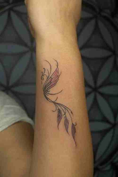 Feminine phoenix wrist tattoo by