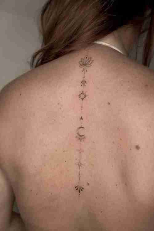 Minimalist spine tattoo for women champ.art