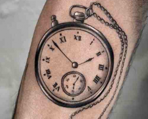 Small clock tattoo