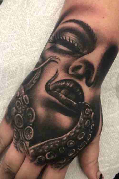 This is an excellent example of how an octopus tattoo can be wrapped around  an arm | Ratta Tattoo