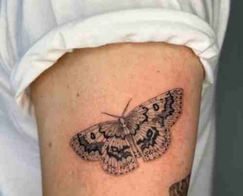 Small moth tattoo