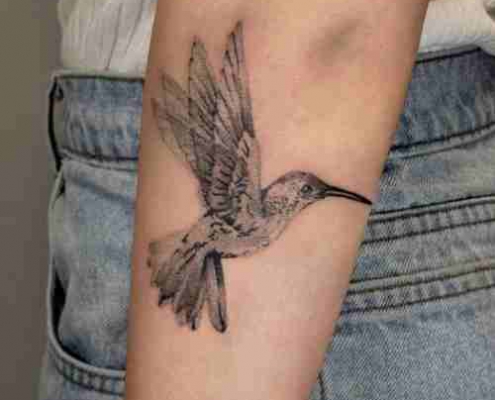 Black and white Flying hummingbird tattoo